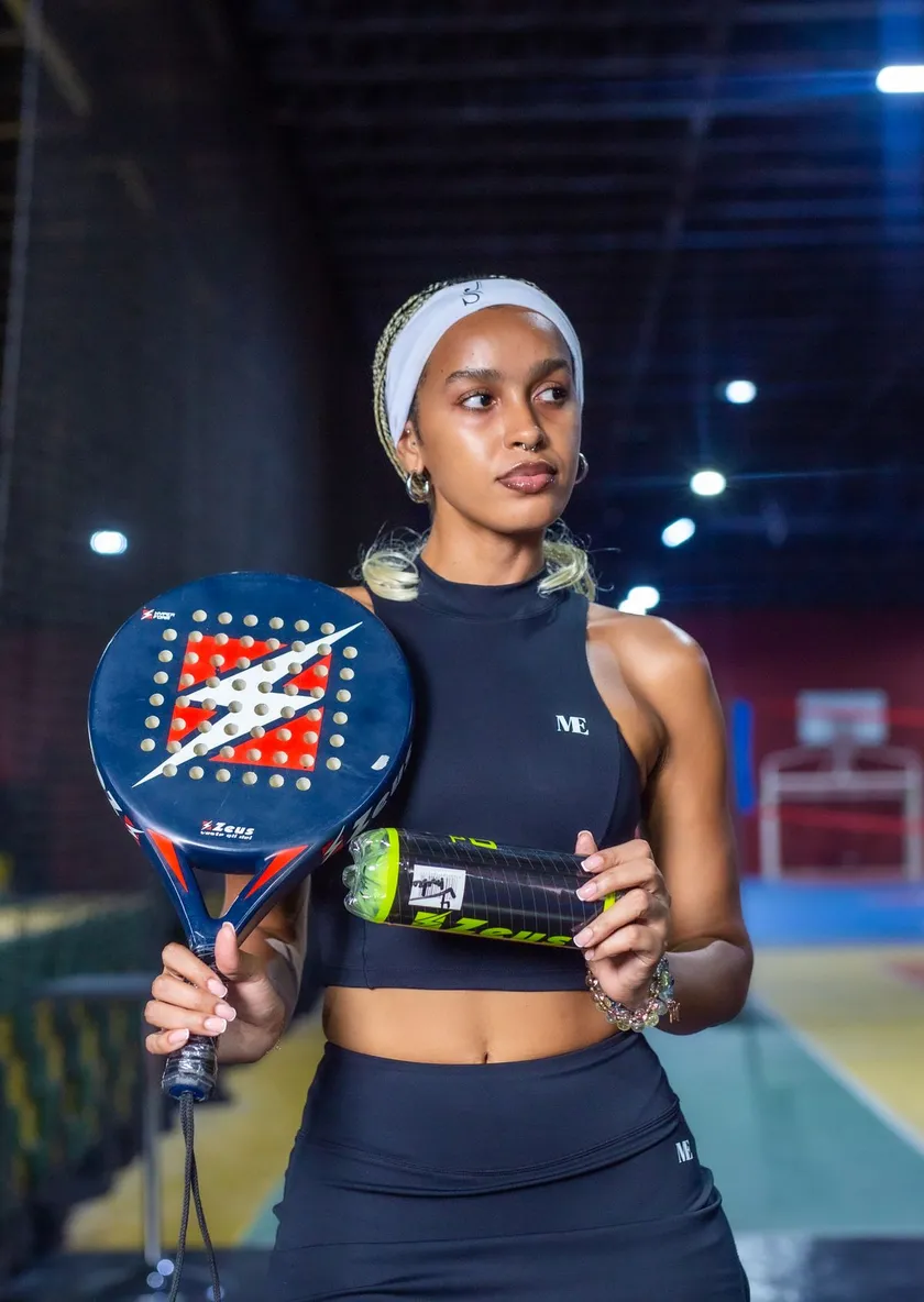 Padel player on an indoor court in Birmingham
