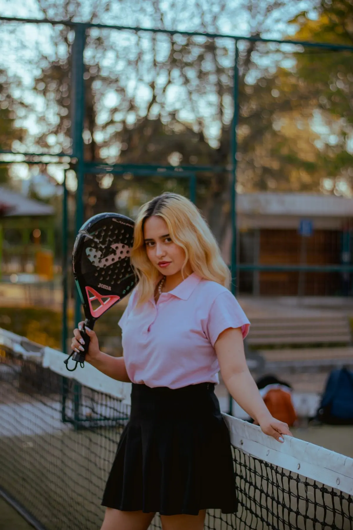 Player with padel racket on court
